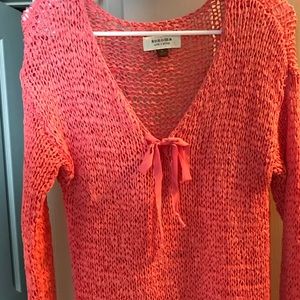 Melon colored cable knit sweater
